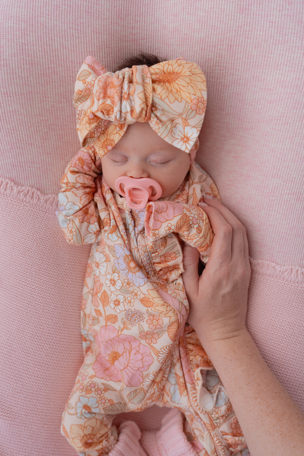 Pastel Bloom newborn frill romper – front view